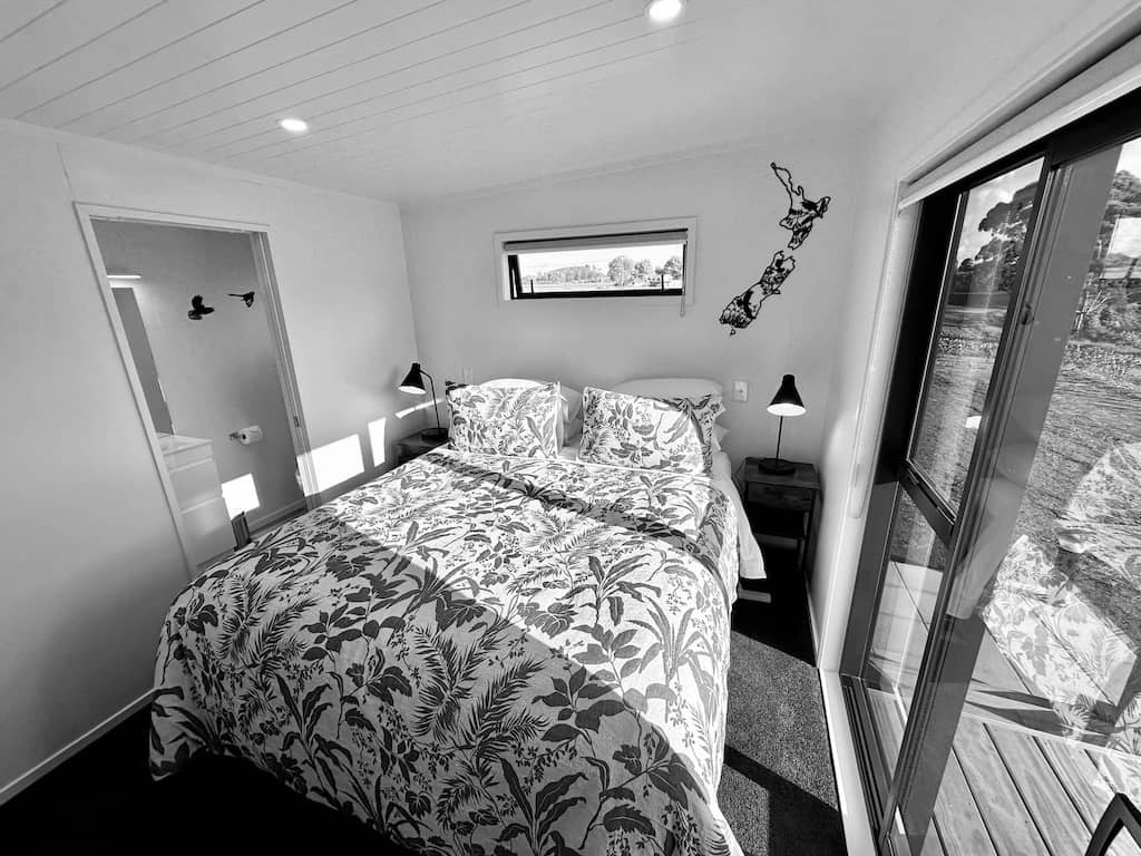 Bedroom Kereru Cabin black and white